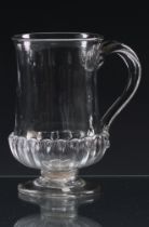 A late 18th century glass coin tankard c.1780, with slightly everted rim, basal moulded gadrooning