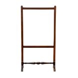 A Victorian mahogany glazed fire screen the rectangular clear glazed screen on trestle supports