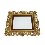 A 19th century Italian Rococo Florentine-style rectangular giltwood wall mirror with an ornately