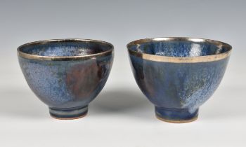 Studio Pottery, a pair of blue glazed ceramic footed bowls with silvered rims
