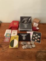 A collection of Jersey commemorative coin sets and coins