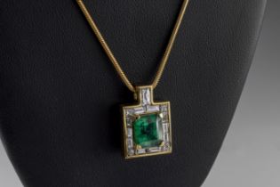 An 18ct yellow gold emerald and diamond pendant