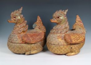 A pair of Indonesian carved wood, metal and polychrome ducks
