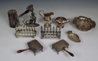 A group of small silver plated table items