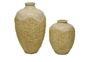 Two Pila Vessel fossil limestone urns by En Gold, Australia, late 20th century