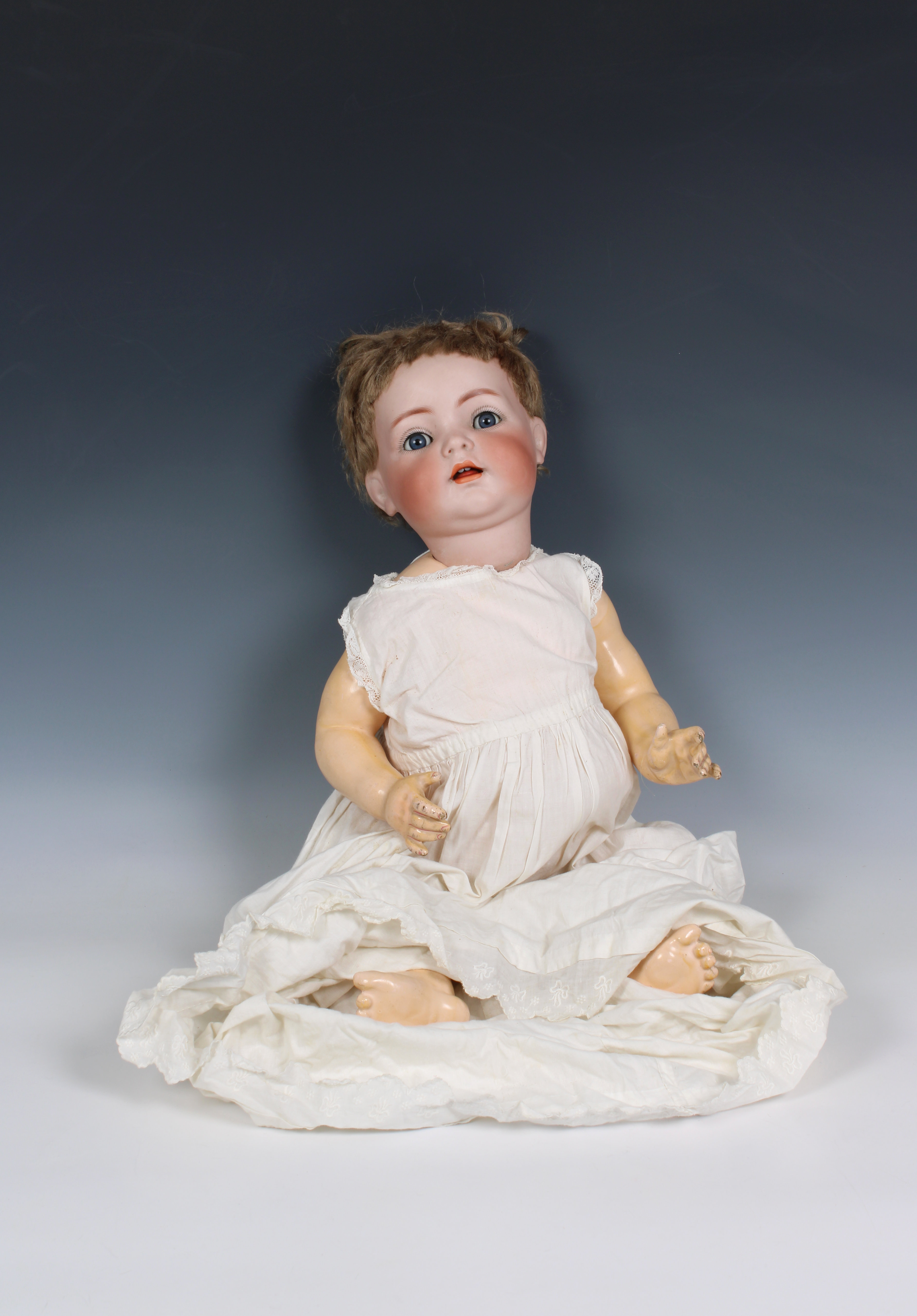 A Victorian porcelain headed doll
