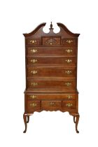 An American Queen Anne style bonnet top highboy by Bernhardt