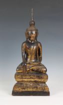 A Thai lacquered & gilded figure of Buddha Shakyamuni