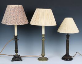 Three various brass and bronze table lamps with fluted columns