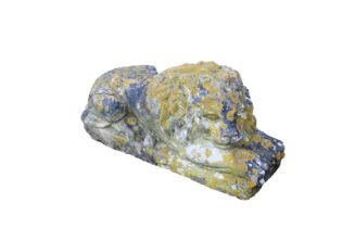 A painted composite stone recumbent lion