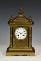 A French brass architectural mantel clock