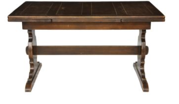 A mid 20th century stained oak draw leaf table