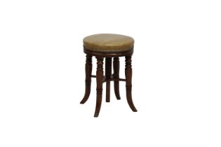 A late Regency walnut music stool