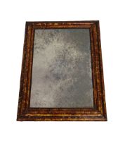 A 19th century faux tortoiseshell wall mirror