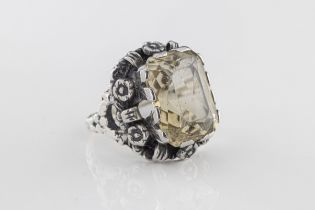 A silver and citrine dress ring