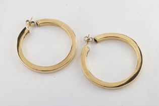 A pair of 9ct yellow gold hoop earrings