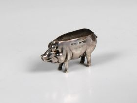 A novelty Edwardian silver pin cushion fashioned as a pig