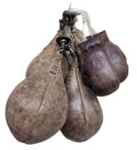 Four decorative leather boxing speed ball punch bags with metal brackets, together with a pair of mi