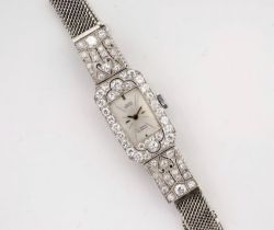 A mid-century 18ct white gold and diamond cocktail watch