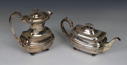 An Edwardian silver teapot and matching hot water pot