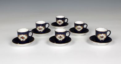 A set of six Royal Worcester blue fish scale coffee cans