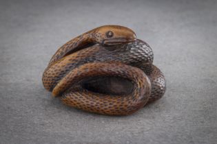 AN EXCEPTIONAL AND LARGE WOOD NETSUKE OF A SNAKE