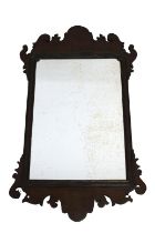 A George III mahogany fretwork wall mirror