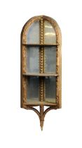 A late 19th century gilt and composition mirrored corner shelf