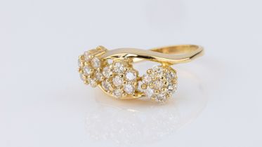 An 18ct yellow gold and diamond triple floral cluster ring