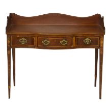 An Edwardian serpentine inlaid mahogany dressing table with three quarter gallery