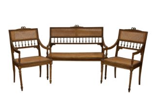 A three piece French beechwood and caned parlour suite