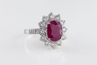 An 18ct white gold ruby and diamond cluster ring