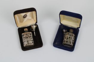 Two silver cased glass perfume bottles