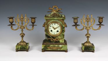 A 19th century French green onyx ormolu mounted three piece clock garniture