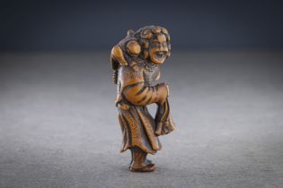 A WOOD NETSUKE OF A DUTCHMAN WITH CHILD