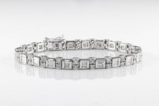 An 18ct white gold and diamond line bracelet