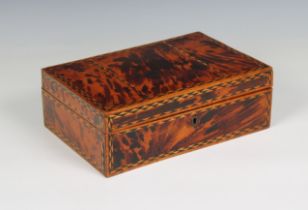 An inlaid wooden sewing box with eight compartments