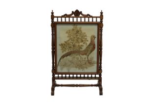 A Victorian oak fire screen