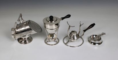 A silver plated sugar box in the form of a floral engraved coal scuttle and shovel