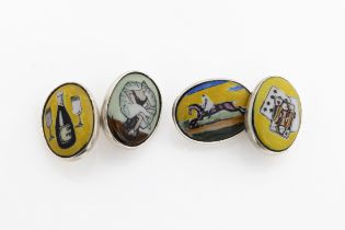 A pair of silver and enamel novelty oval cuff links