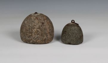 Two small granite corn weights