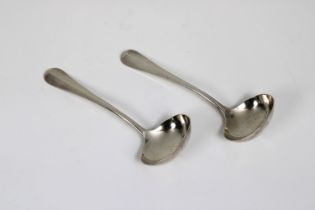 A pair of silver sauce ladles