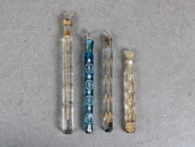 Four Georgian glass scent bottles with glass stoppers