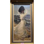 W R Lavender:  Edwardian lady in white dress and hat on a windswept beach, oil on canvas, signed, 52