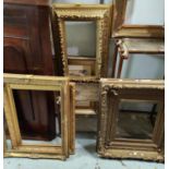 A selection of large antique gilt picture frames with various designs and sized, largest overall