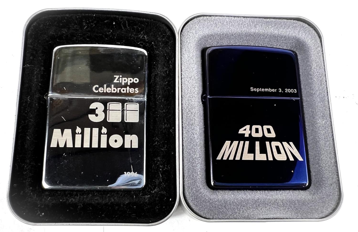 Two Zippo lighters commemorating 300 million & 400 million sales