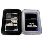 Two Zippo lighters commemorating 300 million & 400 million sales