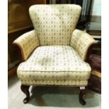 A mid 20th century period style mahogany armchair on carved cabriole legs, in floral brocade