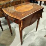 A reproduction Regency Pembroke table in crossbanded yew wood, with inlaid oval top and frieze