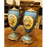 A pair of Ormolu & Sevres porcelain 2 handled classical urn shaped table lamps with polychrome on